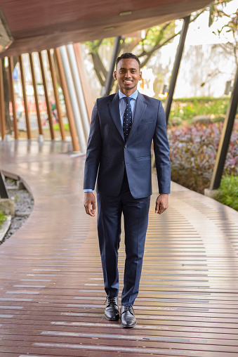Portrait of successful young African businessman wearing suit and tie