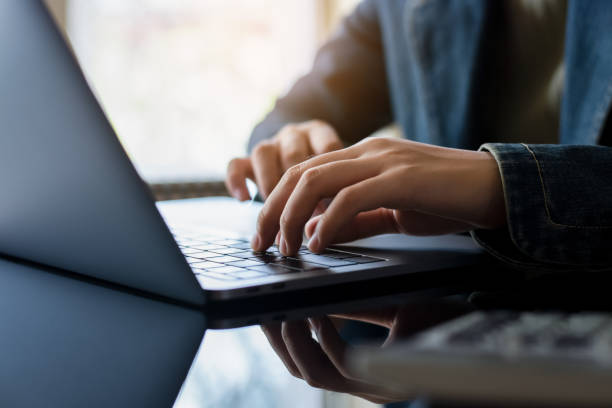 istock Business woman hands typing on laptop computer keyboard 1303685927
