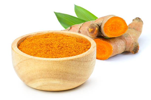 istock turmeric powder isolated on white background. 1303686619