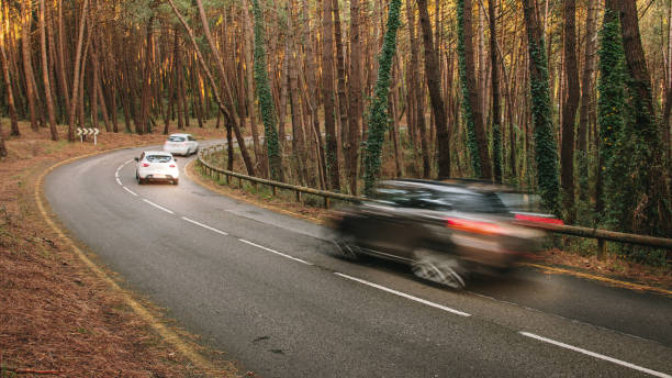 istock Cars in motion on a road 1303687453