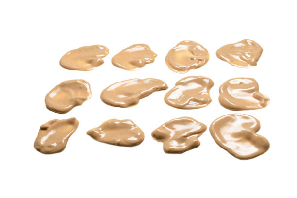 istock Mushroom sauce splashes isolated on white background. 1303688115