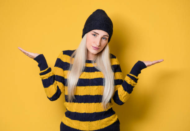 istock Solution. Young woman with open arms let you to choosing, isolated on white background 1303689053