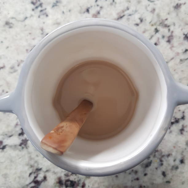 istock Coffe cup and wooden spoon 1303689787