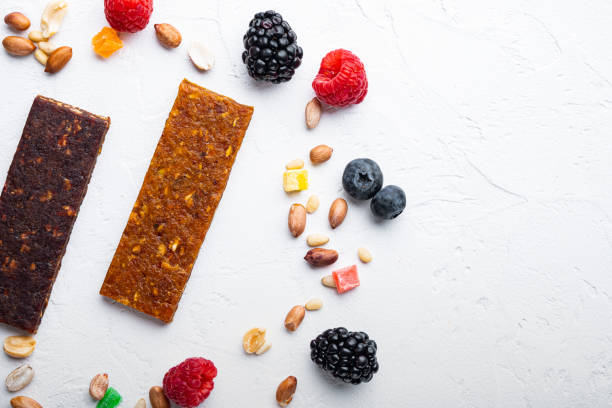 istock Dried fruits bars, flat lay with space for text, on white background 1303691448