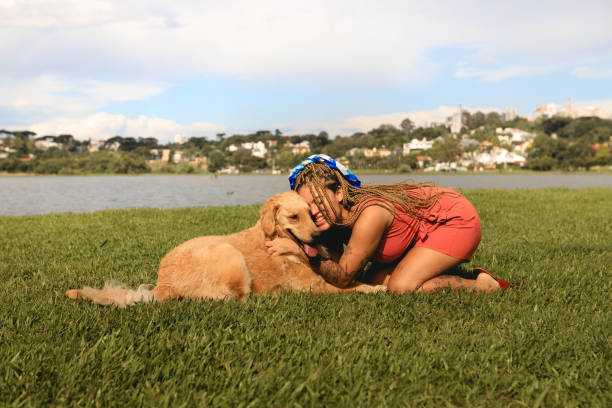 istock woman plays with her dog 1303693168
