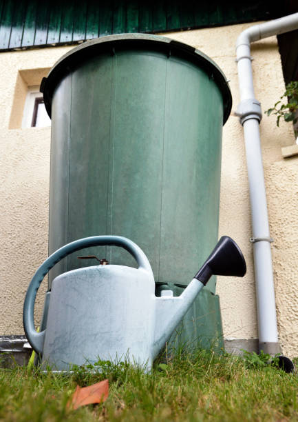istock Ecological system with rainwater tank or water butt 1303693254