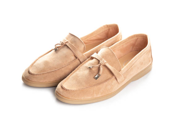 istock brown suede loafers shoes. Studio shot, white background 1303695687