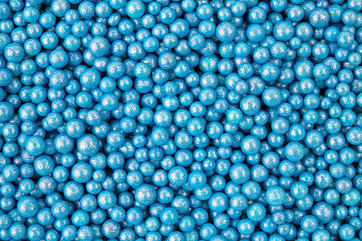 Tiny blue balls. There are no people in the vibrant color, full-frame image