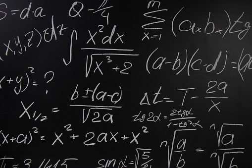 Blackboard background with mathematical formulas. Education concept.