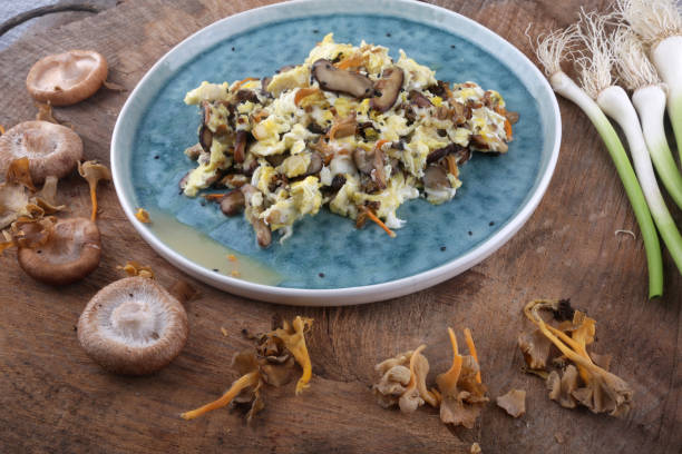 istock mushroom and fresh garlic scramble eggs 1303699922