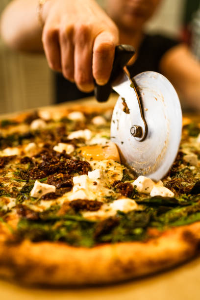 istock Chef Pizzer Preparing fresh Pizza for Serving. Restaurant Waiter at Work 1303699945