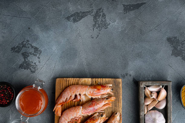 istock Sticky Mango Prawns ingredients, on gray background, top view flat lay , with copyspace  and space for text 1303701456