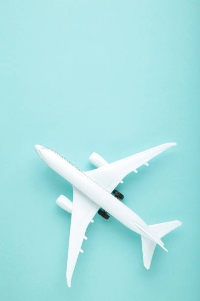 istock Model airplane on blue pastel color background. 1303701721
