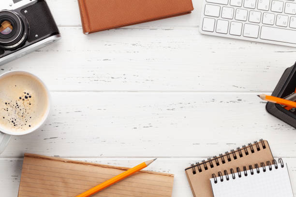 istock Office desk with supplies and photo camera 1303702475