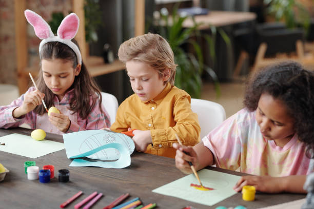 istock Children painting at the table 1303704583