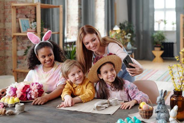 istock Woman making selfie with children 1303704595