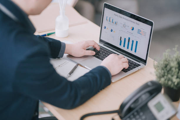 istock asian chinese man working in office with laptop 1303704751