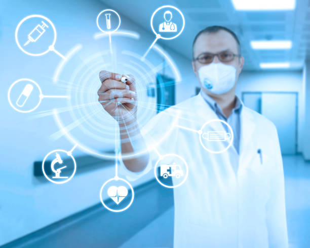 istock Doctor wearing a mask writing on transparent board 1303705468