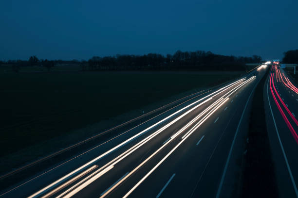 istock Night Autobahn, highway. Light lines from cars. 1303705924