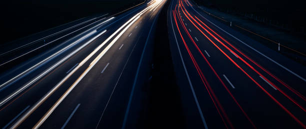 istock Night Autobahn, highway. Light lines from cars. 1303706106