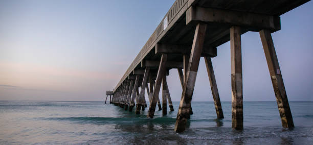 istock Sunrise beneath an ocean pier. 1303708330
