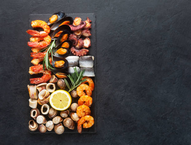 istock Seafood charcuterie board with shrimp, oysters, fish and octopus 1303711320