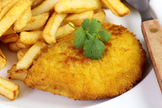 istock breaded meat with fries 1303711357