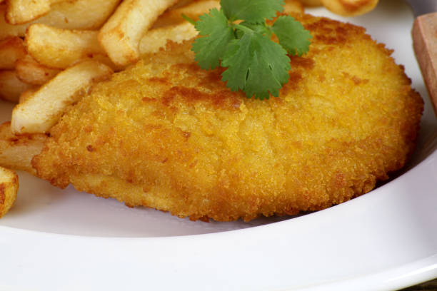 istock breaded meat with fries 1303711375