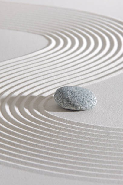 istock Japanese ZEN garden with rock in sand 1303712733