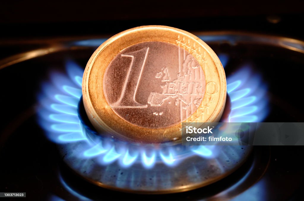 costs of energy and Euro coin Natural Gas Stock Photo