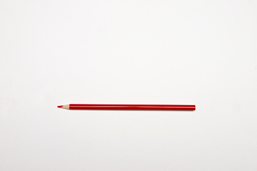 Red pencil on white.
