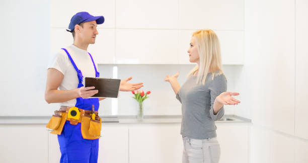 istock a washing machine repair service with female customer 1303716286