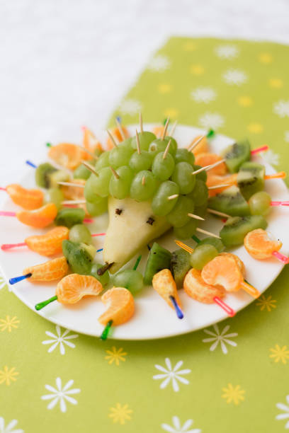 baby food in the form of a hedgehog from grapes.