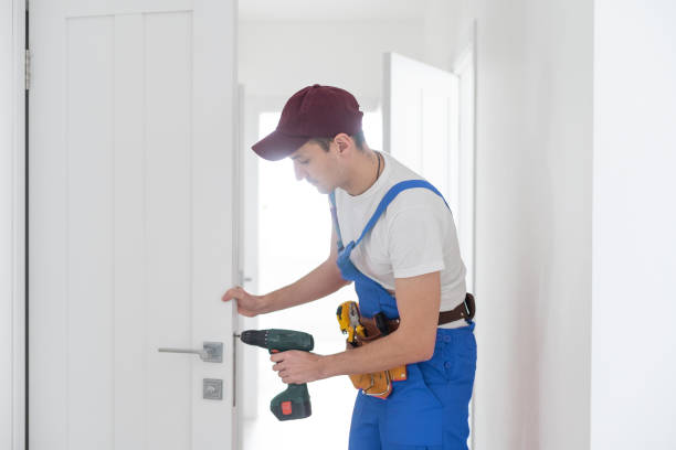 istock The master adjusts the fittings in the doors. The plastic door jammed does not work. The plastic door does not open 1303716831