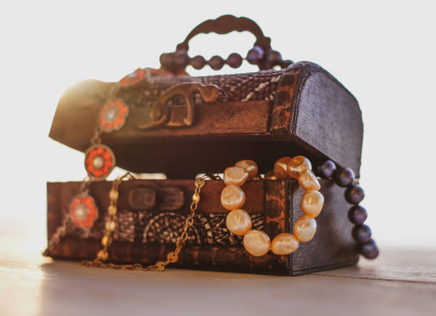 istock Old treasure chest with precious close-up, sunlight effect, selective focuse 1303717923