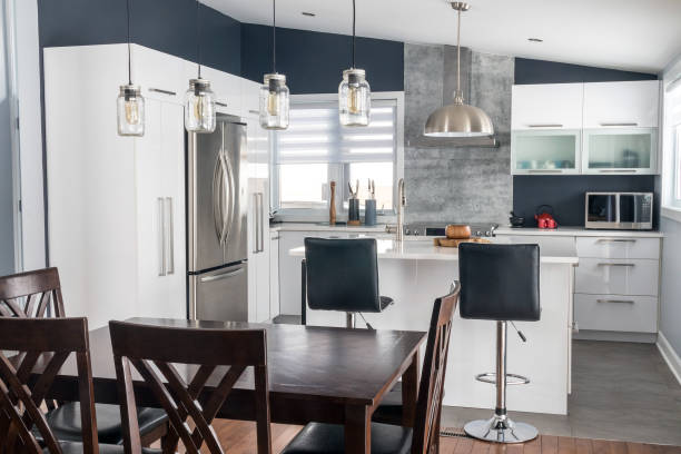 istock elegant new modern home interior dining room and kitchen 1303718320