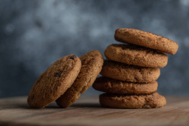 istock Delicious cookies with chocolate on a gray background 1303719280