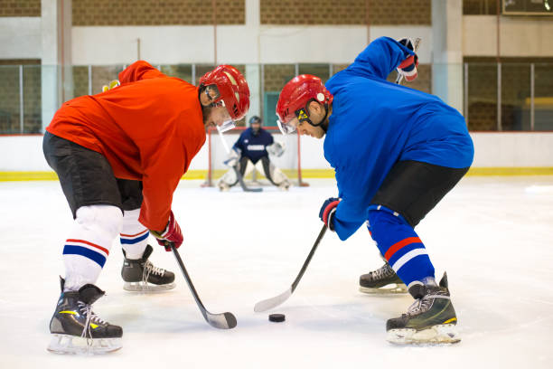 istock Hockey players playing ice hockey 1303719302