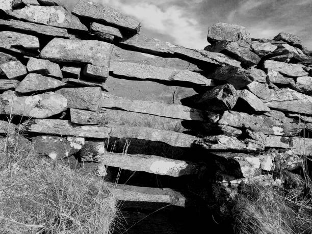 istock Stone rock fence wall in the mountain 1303722171