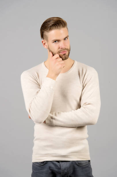 istock Guy touch beard on unshaven face, grooming 1303723385
