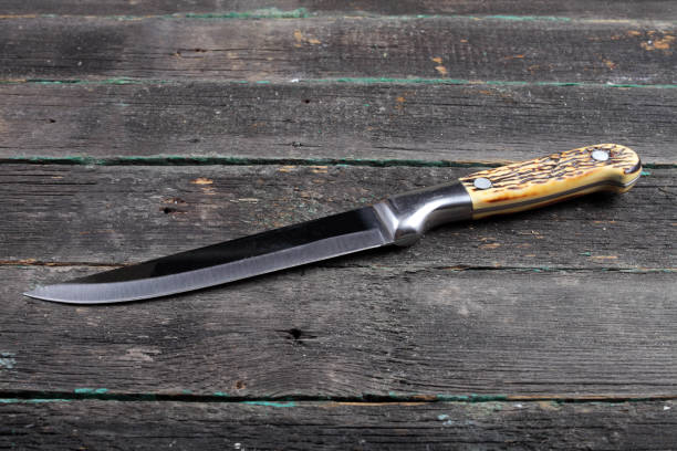 istock kitchen knife on a wooden background 1303724796