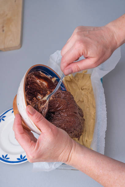 istock Paris, France - 02 14 2021: Preparation of a marble chocolate cake 1303725993