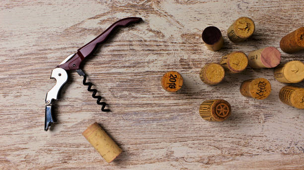 istock corkscrews and wine corks on an aged white wood board 1303729198