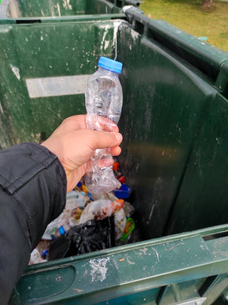 istock throw the plastic bottle in the trash can 1303729352