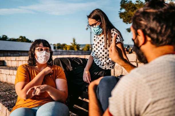 istock Friends speak in sign language 1303730947