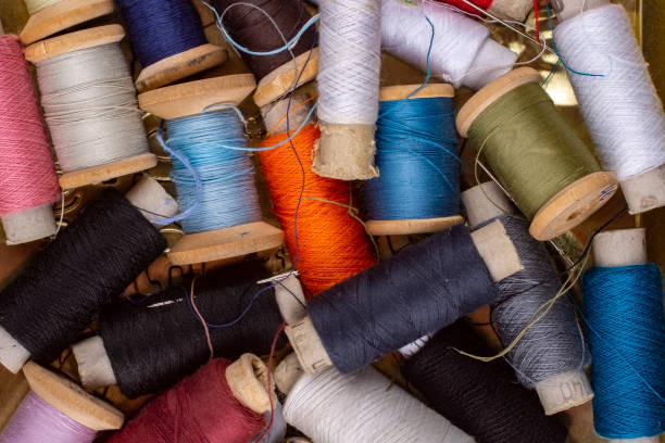 istock Many colorful skeins of thread close up. 1303731746