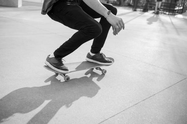 istock Unrecognizable skateboarder doing olie jump in skatepark 1303731787