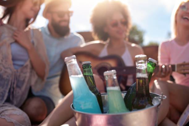 istock Group of young people enjoying on the beach 1303732874