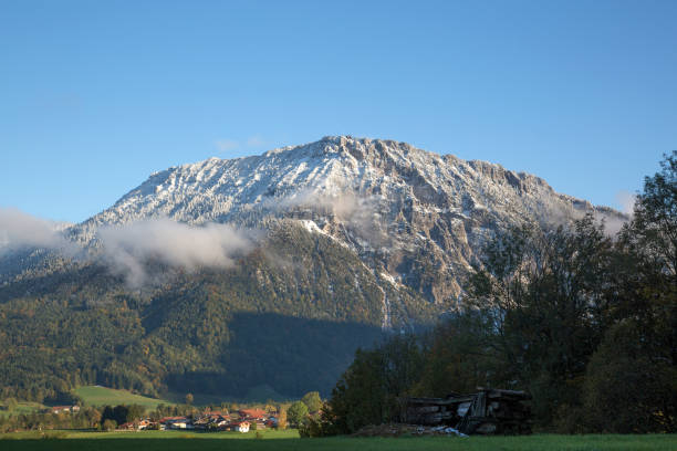 Snow covered mountain with small village in the valley