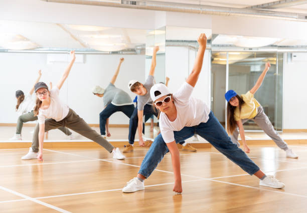 istock Boy and girls having dancing class 1303735831